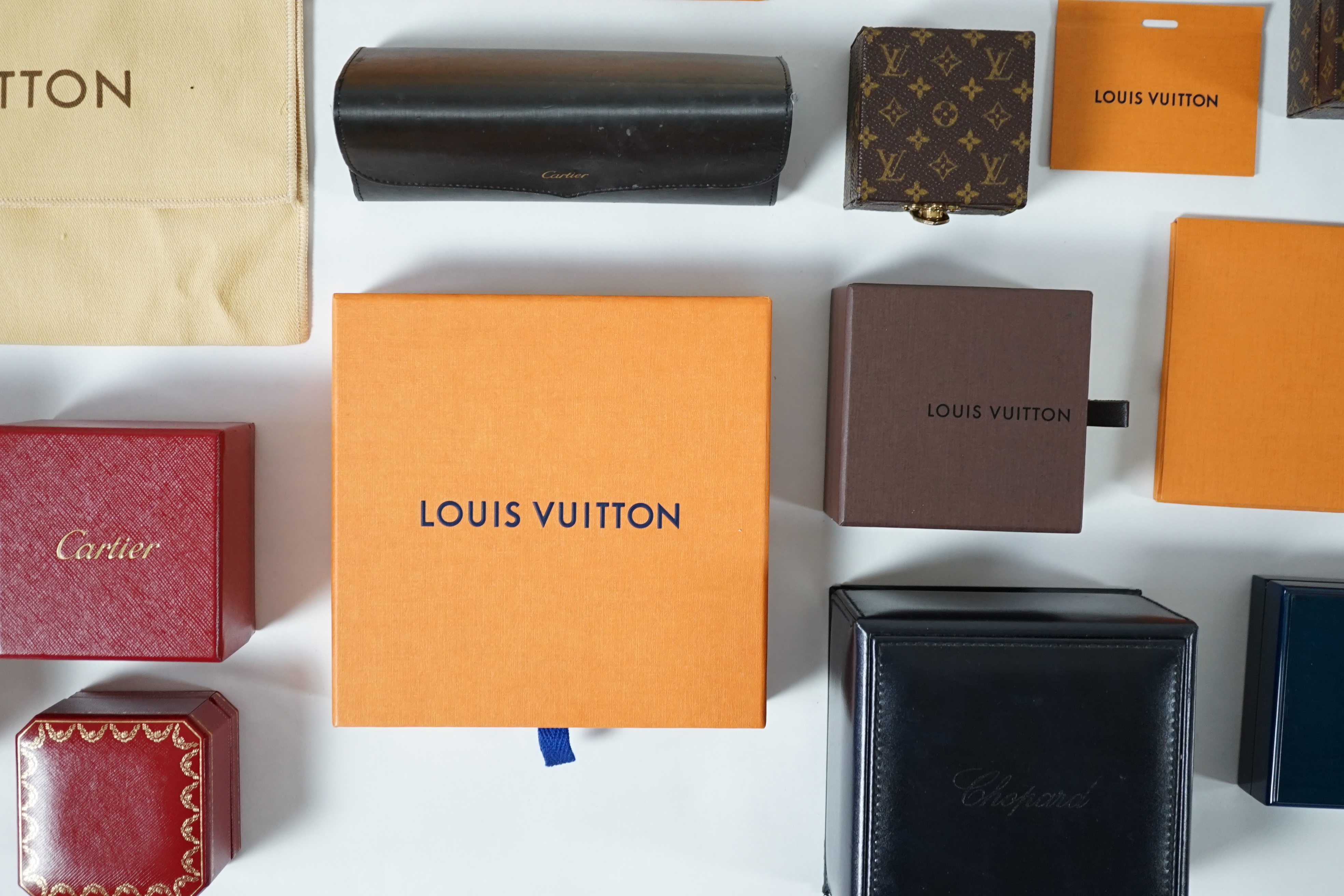 A selection of empty designer boxes including Cartier, Louis Vuitton and Chopard